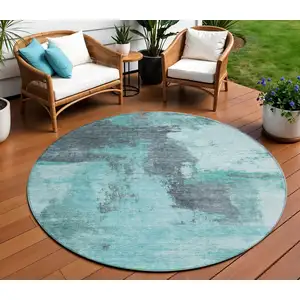 Photo of 8' Teal Blue And Charcoal Round Abstract Washable Indoor Outdoor Area Rug