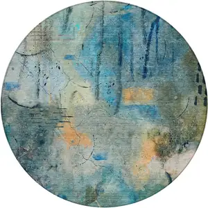Photo of 8' Teal Blue And Gold Round Abstract Washable Indoor Outdoor Area Rug
