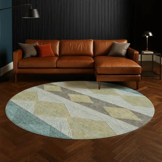 8' Teal Blue And Gold Round Geometric Washable Indoor Outdoor Area Rug Photo 5