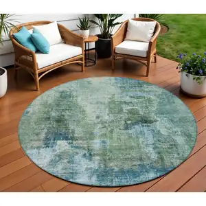 Photo of 8' Teal Blue And Gray Round Abstract Washable Indoor Outdoor Area Rug