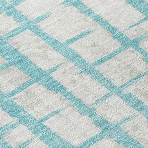 Photo of 8' Teal Blue And Gray Round Striped Washable Indoor Outdoor Area Rug