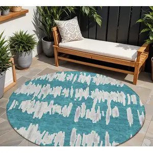 Photo of 8' Teal Blue And Gray Round Striped Washable Indoor Outdoor Area Rug