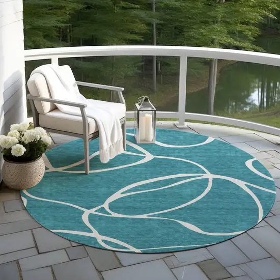 8' Teal Blue And Ivory Round Abstract Washable Indoor Outdoor Area Rug Photo 7