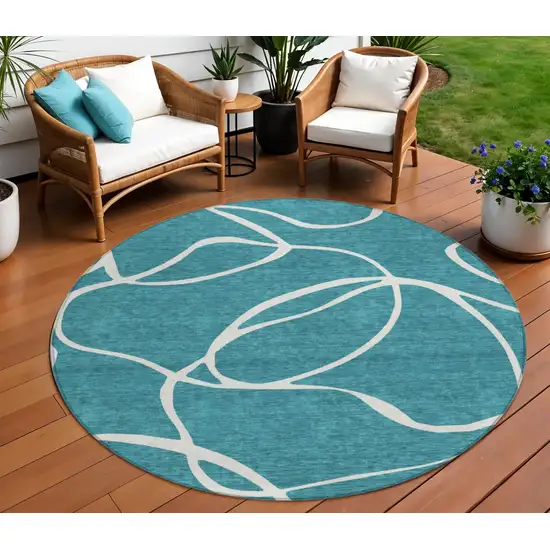8' Teal Blue And Ivory Round Abstract Washable Indoor Outdoor Area Rug Photo 1