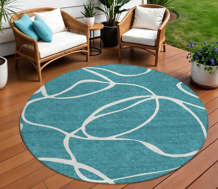 8' Teal Blue And Ivory Round Abstract Washable Indoor Outdoor Area Rug Photo 1