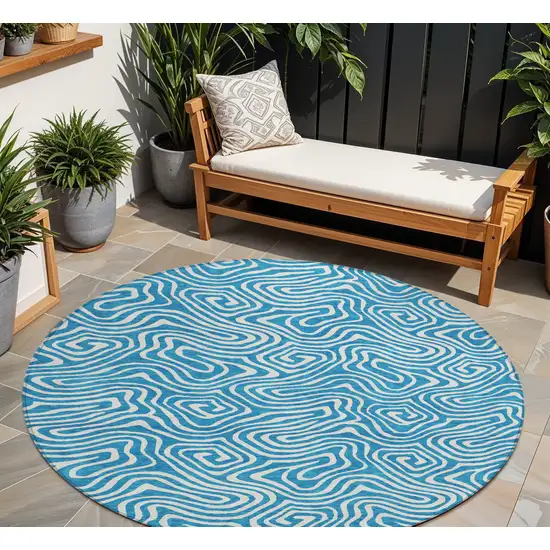 8' Teal Blue And Ivory Round Abstract Washable Indoor Outdoor Area Rug Photo 1