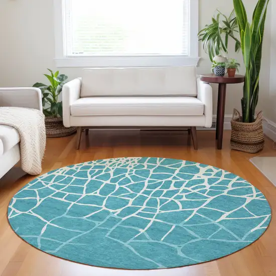 8' Teal Blue And Ivory Round Abstract Washable Indoor Outdoor Area Rug Photo 8