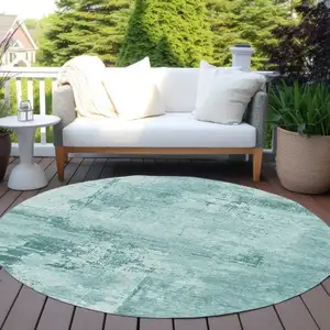 Photo of 8' Teal Blue And Ivory Round Abstract Washable Indoor Outdoor Area Rug