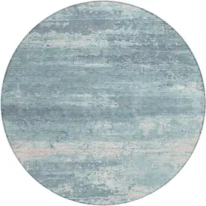 Photo of 8' Teal Blue And Ivory Round Abstract Washable Indoor Outdoor Area Rug