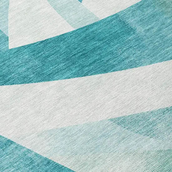 8' Teal Blue And Ivory Round Abstract Washable Indoor Outdoor Area Rug Photo 9