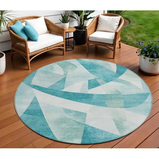 8' Teal Blue And Ivory Round Abstract Washable Indoor Outdoor Area Rug Photo 2