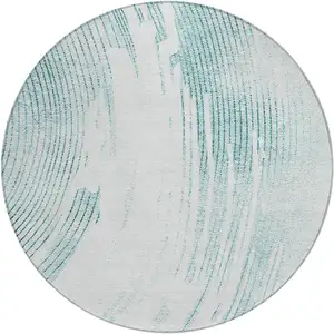 Photo of 8' Teal Blue And Ivory Round Abstract Washable Indoor Outdoor Area Rug
