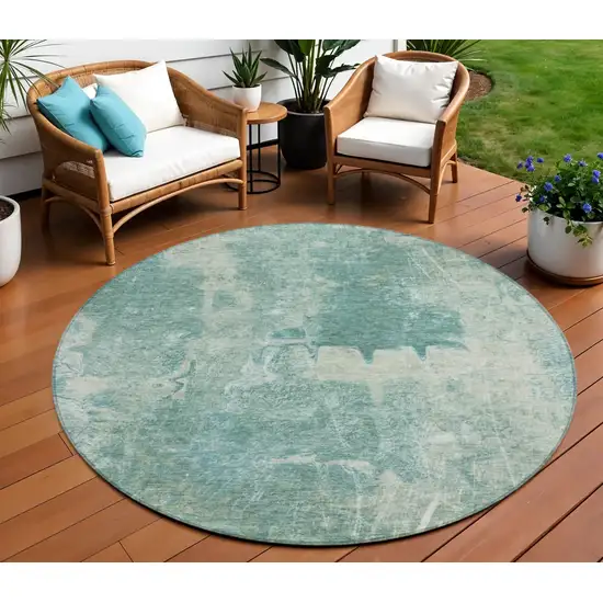 8' Teal Blue And Ivory Round Abstract Washable Indoor Outdoor Area Rug Photo 1