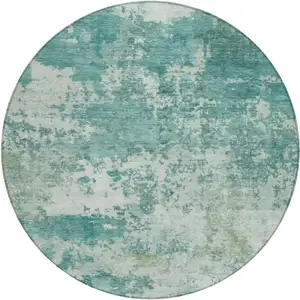 Photo of 8' Teal Blue And Ivory Round Abstract Washable Indoor Outdoor Area Rug