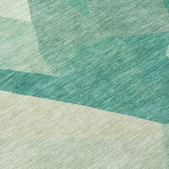 8' Teal Blue And Ivory Round Abstract Washable Indoor Outdoor Area Rug Photo 9