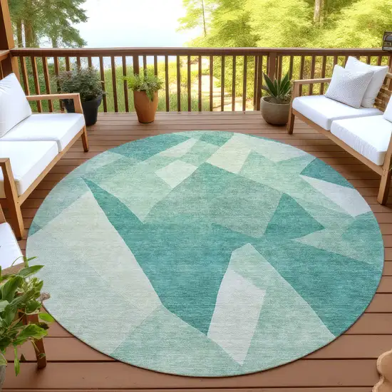 8' Teal Blue And Ivory Round Abstract Washable Indoor Outdoor Area Rug Photo 4