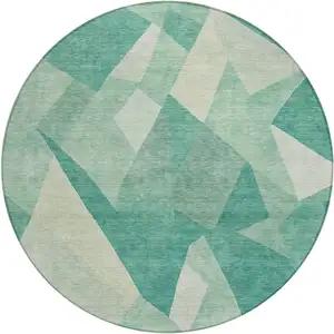 Photo of 8' Teal Blue And Ivory Round Abstract Washable Indoor Outdoor Area Rug