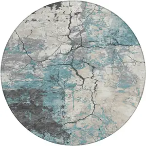 Photo of 8' Teal Blue And Ivory Round Abstract Washable Indoor Outdoor Area Rug
