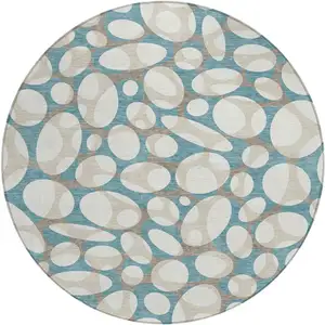 Photo of 8' Teal Blue And Ivory Round Abstract Washable Indoor Outdoor Area Rug