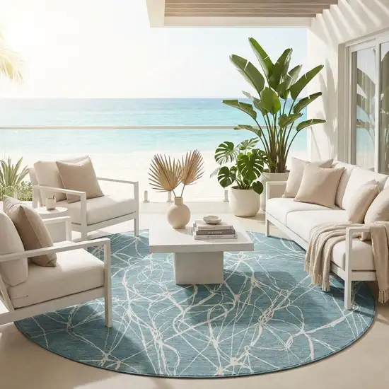8' Teal Blue And Ivory Round Abstract Washable Indoor Outdoor Area Rug Photo 1