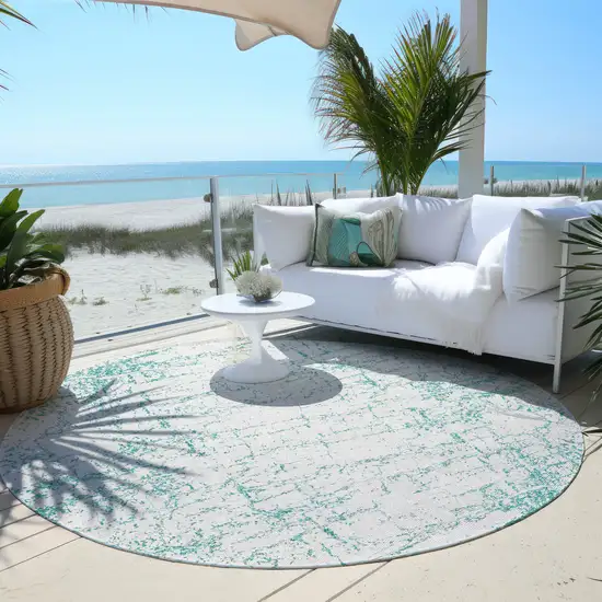 8' Teal Blue And Ivory Round Abstract Washable Indoor Outdoor Area Rug Photo 5