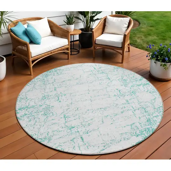 8' Teal Blue And Ivory Round Abstract Washable Indoor Outdoor Area Rug Photo 1