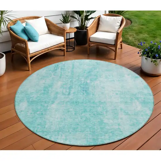 8' Teal Blue And Ivory Round Abstract Washable Indoor Outdoor Area Rug Photo 1