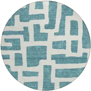 Photo of 8' Teal Blue And Ivory Round Abstract Washable Indoor Outdoor Area Rug