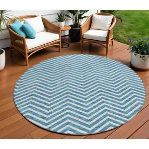 Photo of 8' Teal Blue And Ivory Round Chevron Washable Indoor Outdoor Area Rug
