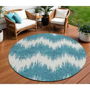 Photo of 8' Teal Blue And Ivory Round Chevron Washable Indoor Outdoor Area Rug