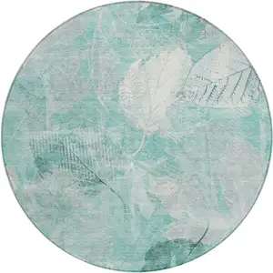 Photo of 8' Teal Blue And Ivory Round Floral Washable Indoor Outdoor Area Rug