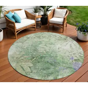 Photo of 8' Teal Blue And Ivory Round Floral Washable Indoor Outdoor Area Rug
