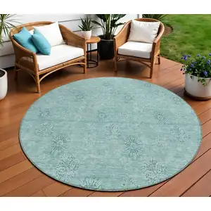 Photo of 8' Teal Blue And Ivory Round Floral Washable Indoor Outdoor Area Rug