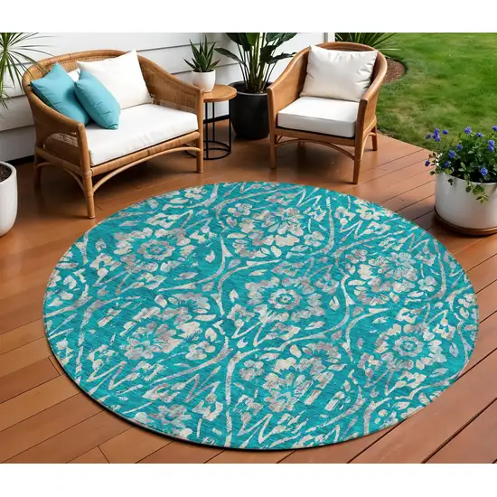 8' Teal Blue And Ivory Round Floral Washable Indoor Outdoor Area Rug Photo 1