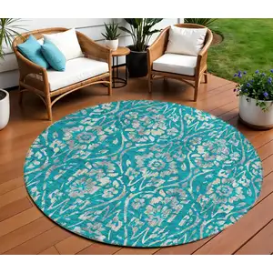 Photo of 8' Teal Blue And Ivory Round Floral Washable Indoor Outdoor Area Rug