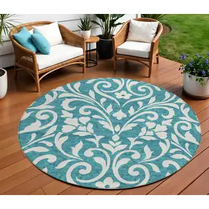 Photo of 8' Teal Blue And Ivory Round Floral Washable Indoor Outdoor Area Rug
