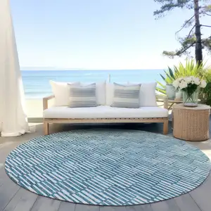 Photo of 8' Teal Blue And Ivory Round Geometric Washable Indoor Outdoor Area Rug