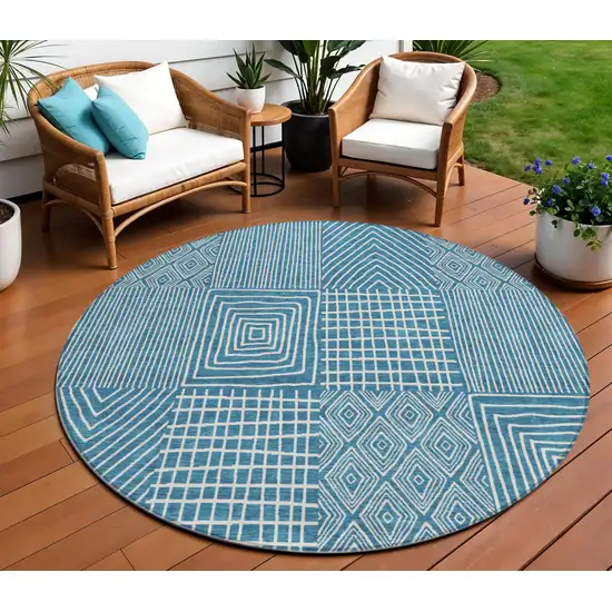 8' Teal Blue And Ivory Round Geometric Washable Indoor Outdoor Area Rug Photo 1