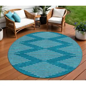 Photo of 8' Teal Blue And Ivory Round Geometric Washable Indoor Outdoor Area Rug