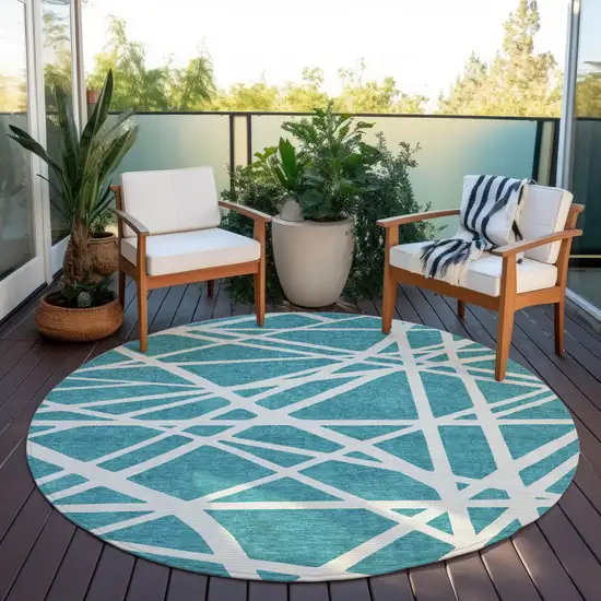8' Teal Blue And Ivory Round Geometric Washable Indoor Outdoor Area Rug Photo 6