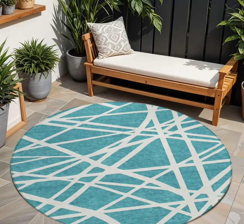 8' Teal Blue And Ivory Round Geometric Washable Indoor Outdoor Area Rug Photo 1