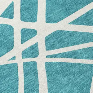 Photo of 8' Teal Blue And Ivory Round Geometric Washable Indoor Outdoor Area Rug