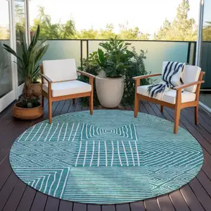Photo of 8' Teal Blue And Ivory Round Geometric Washable Indoor Outdoor Area Rug
