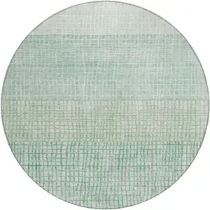Photo of 8' Teal Blue And Ivory Round Geometric Washable Indoor Outdoor Area Rug