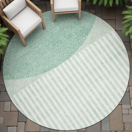 8' Teal Blue And Ivory Round Geometric Washable Indoor Outdoor Area Rug Photo 6