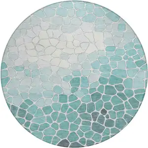Photo of 8' Teal Blue And Ivory Round Geometric Washable Indoor Outdoor Area Rug