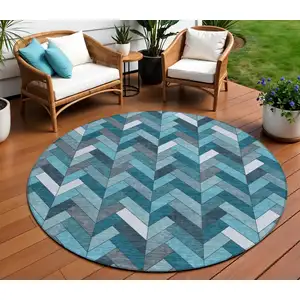 Photo of 8' Teal Blue And Ivory Round Geometric Washable Indoor Outdoor Area Rug