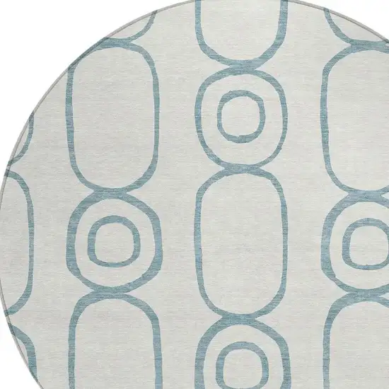 8' Teal Blue And Ivory Round Geometric Washable Indoor Outdoor Area Rug Photo 7