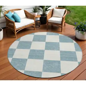 Photo of 8' Teal Blue And Ivory Round Geometric Washable Indoor Outdoor Area Rug