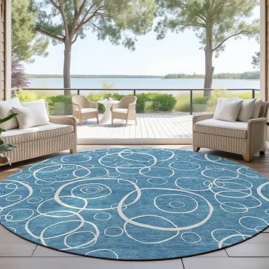 8' Teal Blue And Ivory Round Geometric Washable Indoor Outdoor Area Rug Photo 4